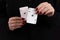 Female hands hold a deck of cards and show tricks.