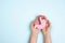 Female hands hold human stomach model on blue background. World Digestive Health Day