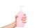 female hands hold liquid soap bottle with copy space