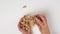 Female hands hold peanuts in shell, white background