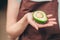 Female hands holding avocado