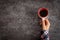 Female hands holding coffee cup over dark table