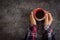 Female hands holding coffee cup over dark table