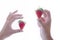 Female hands holding delicious looking strawberries on a light background. Healthy food concept