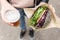 Female Hands Holding Delicious Organic Salmon Vegetarian Burger and Homebrewed IPA Beer.