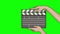 Female hands holding a film clapper black board isolated on green background. Isolated 2D render movie clapper cinema