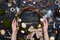 Female hands holding a handmade willow wreath, flay lay pi