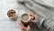 Female hands holding a mug with coffee, slow motion. Cozy autumn composition. Hygge concept