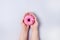 Female Hands Holding Sweet Donut with Sprinkles Blue Background Tasty Donut Top View