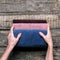 Female hands holds stack bath towels cotton