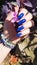 Female hands with long nails with blue nail polish