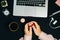 Female Hands with Macaroons Coffee Laptop on Black Background H