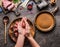 Female hands making meat balls on kitchen table background with meat, force meat , meat grinder and spoon, top view. Cooking,reci