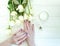 Female hands manicure , cream natura wellness l flower rose on a wooden background hygiene