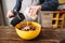 Female hands mixing cake ingredients