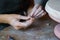 Female hands molding details for pottery decor at art classes for leisure or education in studio