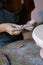 Female hands molding details for pottery decor at art classes for leisure or education in studio