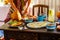 Female hands over a table covered with healthy food terrace in the morning in Villa in a tropical country