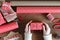 Female hands pack a Christmas gift on a wooden table