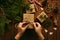 Female hands packing Christmas gifts on table, top view