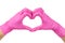 Female hands in pink disposable gloves making a heart shape  on white