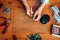 Female hands with pliers, top view, needlework