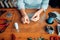 Female hands with pliers, top view, needlework