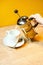 Female Hands Pour Tea from Brewer into Mug on Wooden Table