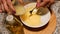 Female hands preparing homemade mayonnaise