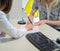 Female hands putting signature to agreement