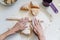 Female hands rolling pasta dough