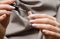 Female hands with rose nail design. Woman hands hold rose varnish bootle and nail brush