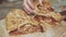 Female Hands Serving Apple Strudel Pieces on Wooden Chopping Board