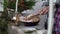 Female hands with a spatula take a piece of apple pie put on a plate. Family dinner concept