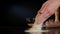 Female Hands Spilling Flour on the Table