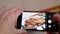 Female Hands Taking Photos of Prepared Juicy Roast Chicken on a Smartphone