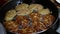 Female Hands Turning Meat Cutlets in a Frying Pan.