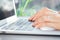 Female hands typing on the laptop keyboard close up. Woman work at computer