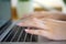 Female hands typing on notebook keyboard studying working with pc technology online education concept on table, close up