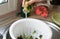 Female hands wash lettuce under the sink