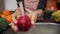 Female hands washing apple under water in sink. Washing the red apples in woman hands, slow motion