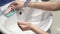 Female Hands Washing in With Water, Soap and Foam Wash hands with soap warm water rubbing fingers washing frequently or