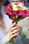 Female hands with wedding bouquet