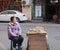 Female hawker selling peanuts