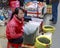 Female hawker selling tieguanyin tea