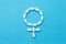 Female health care, gender symbol made of white red medical tablets isolated on blue