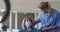 Female health worker talking to senior woman at home