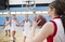 Female High School Basketball Team Passing Ball On Court