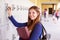 Female High School Student Opening Locker