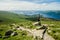 Female hiker admiring the landscape on a path leading to the top